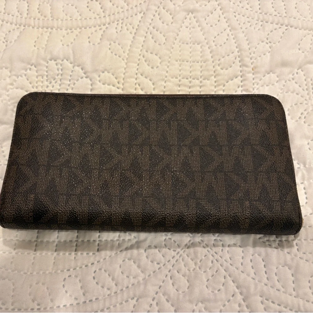 Michael Kors Jet Set Travel continental zip-around wallet in the signature brown